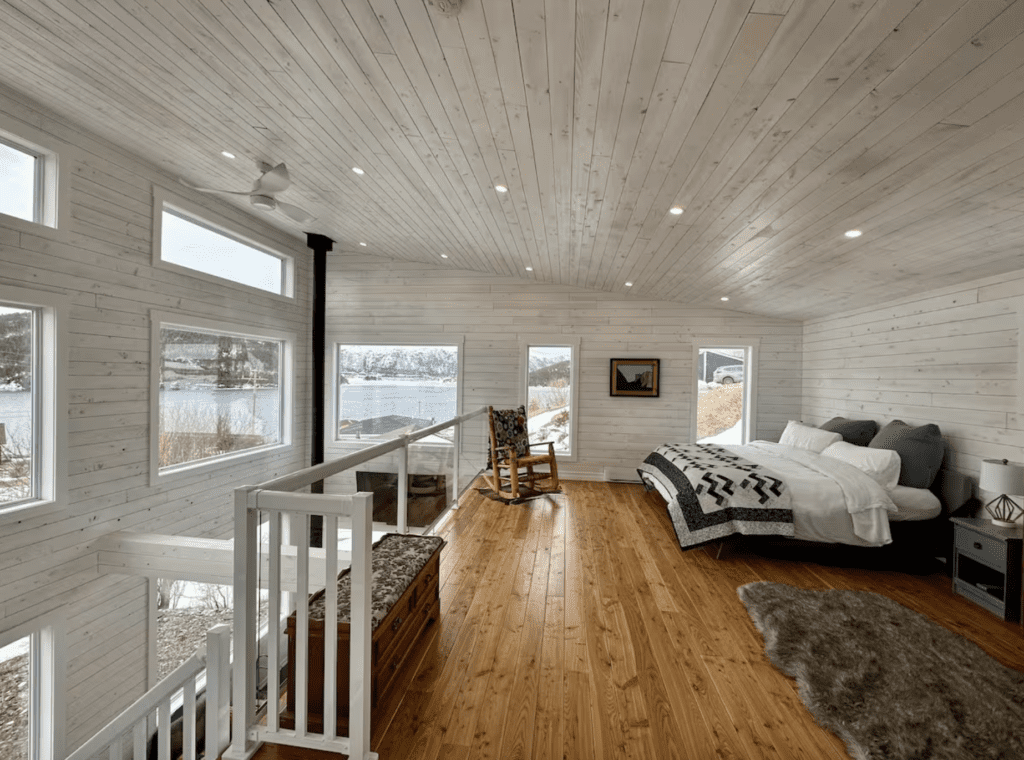 loft style airbnb with floor to ceiling windows in Gros Morne National Park
