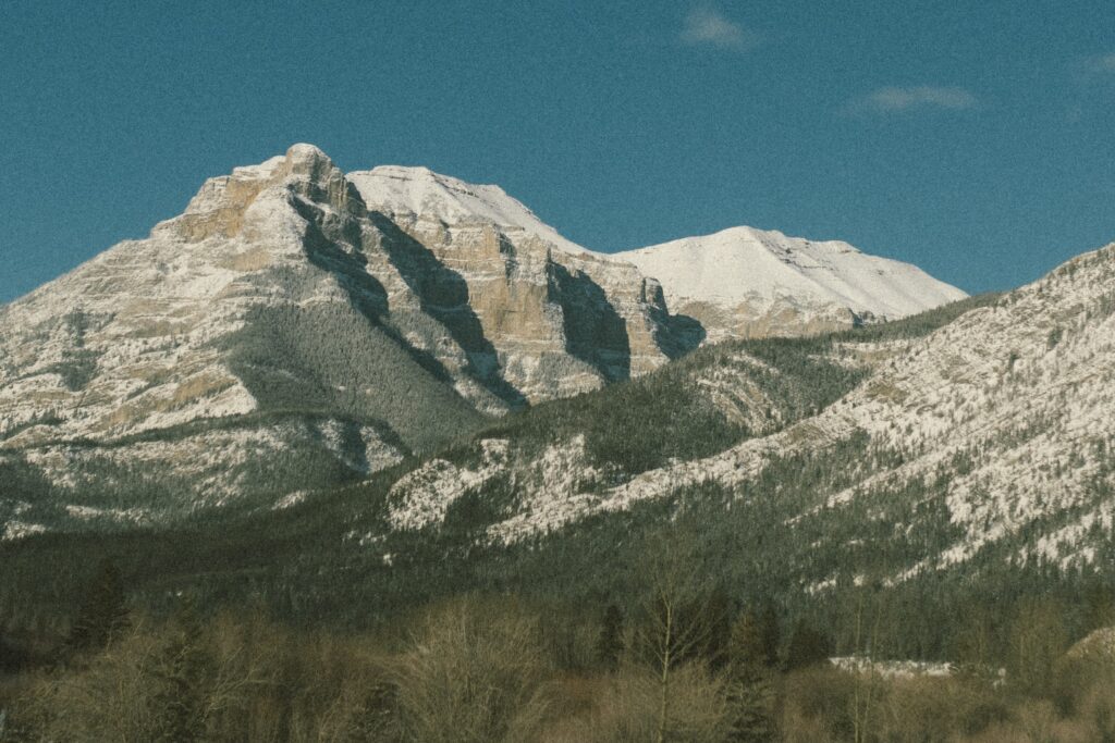 A snow-capped mountain on a sunny day in Banff National Park