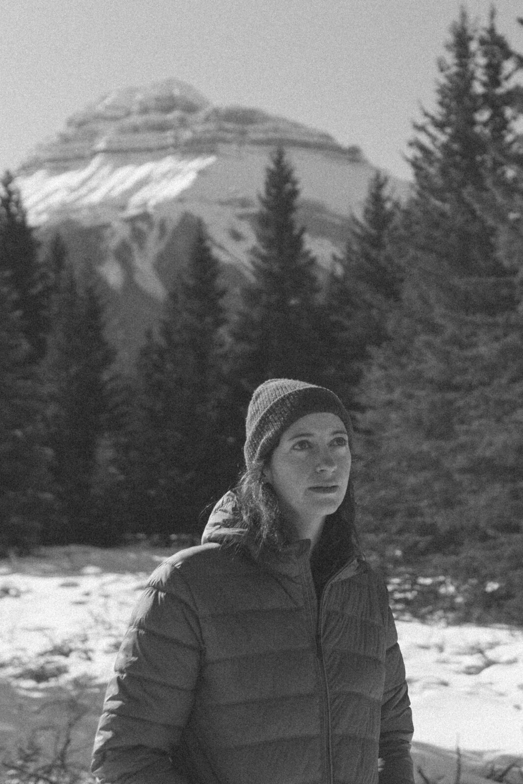 Heather stare in wonder at the mountains outside the frame, with Mount Rundle in Banff National Park rising behind them.