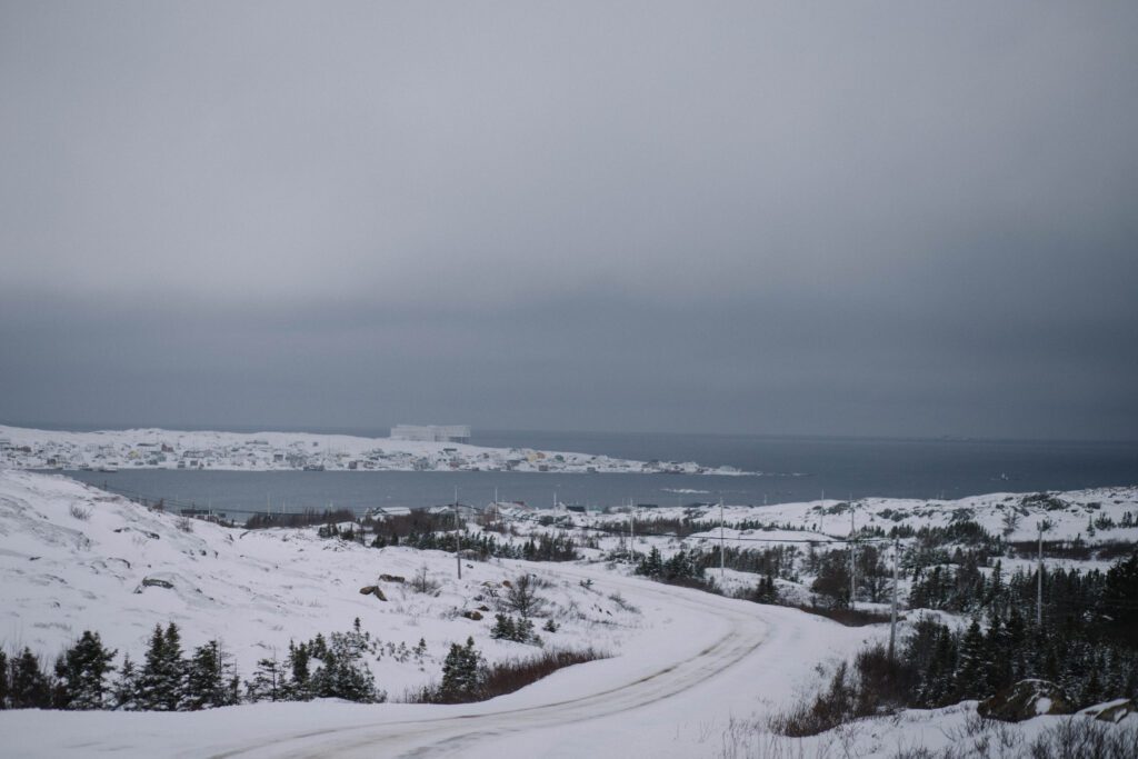 The Fogo Island Inn stands starkly against a snowy Fogo Island landscape
