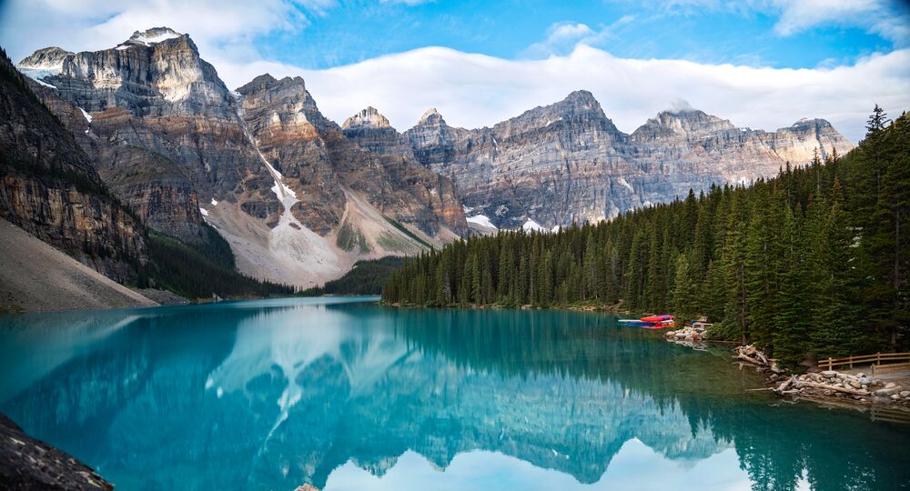 Moraine Lake in Banff National Park, a glacier blue lake with mountains in the background