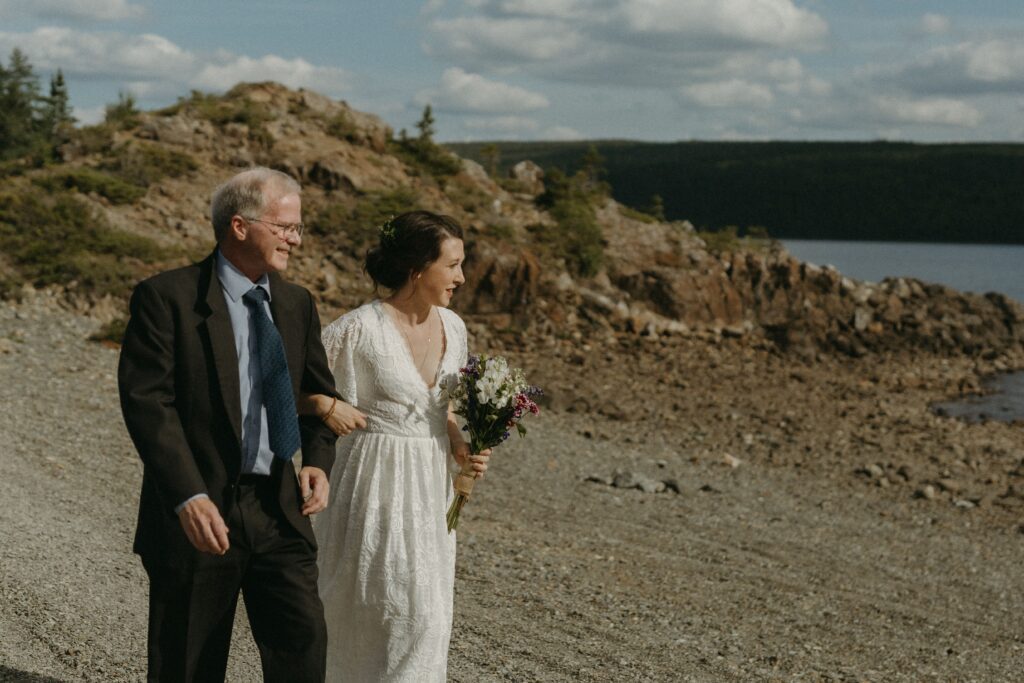 bride and her father approach elopement ceremony