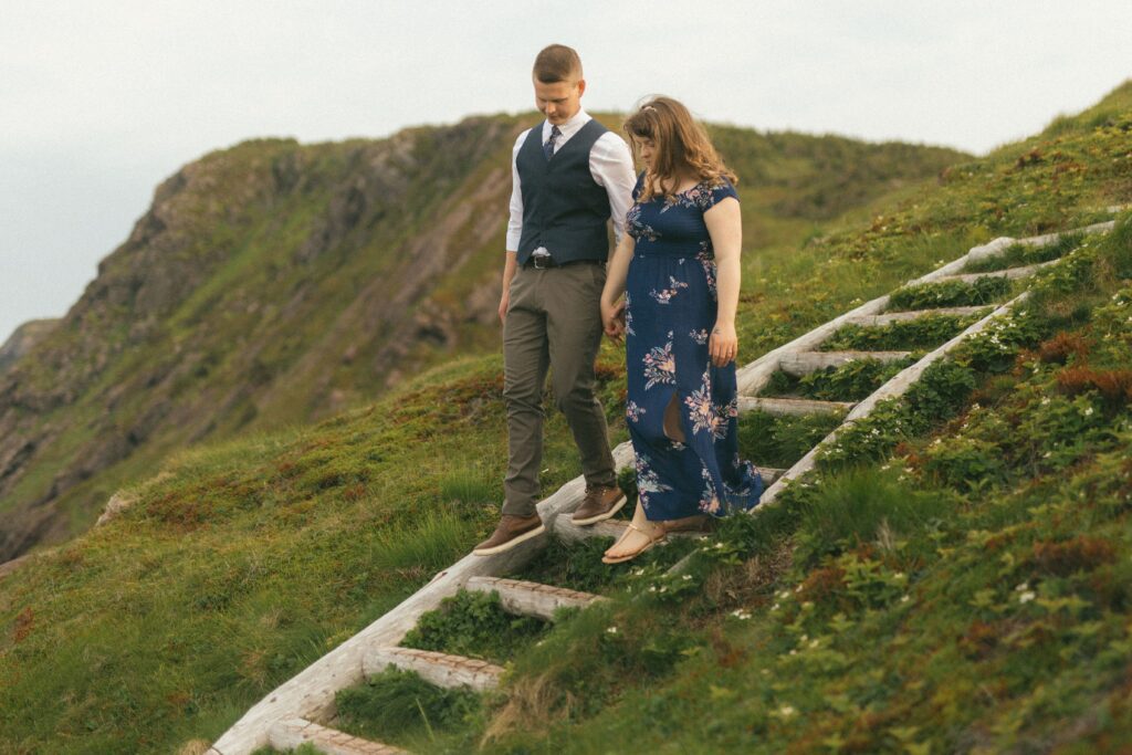 bride and groom explore hiking trail on their elopement day
