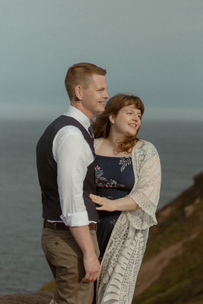 bride and groom smile during elopement ceremony on a hiking trail