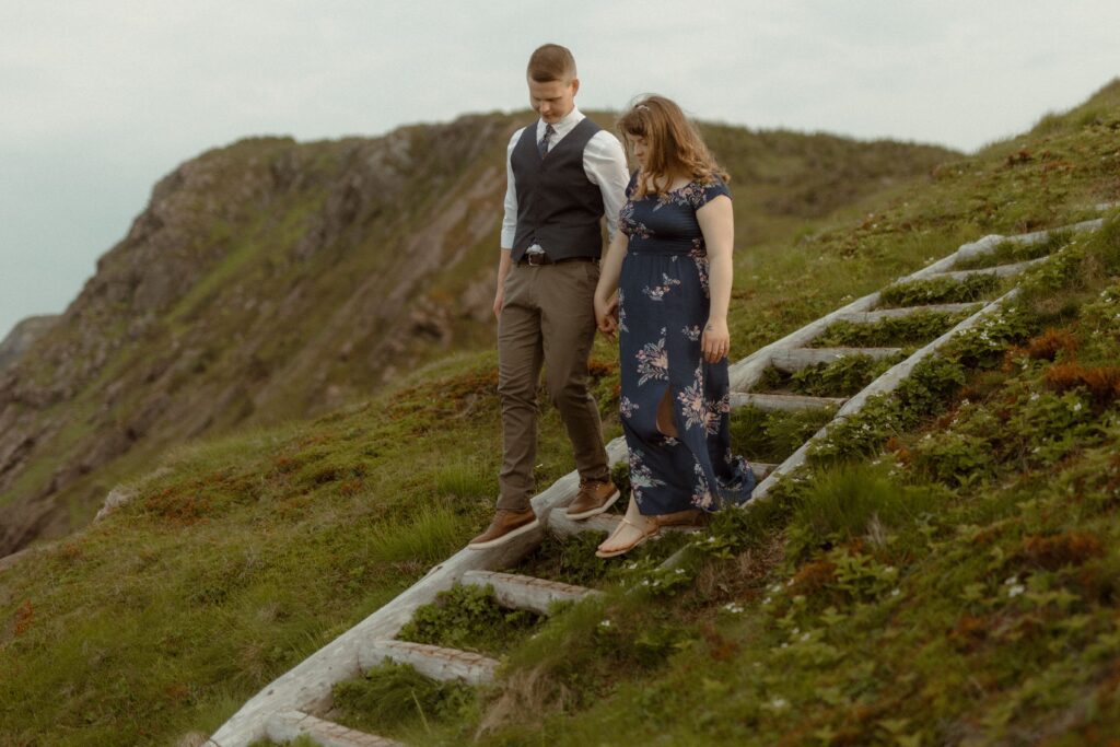 bride and groom explore hiking trail on their elopement day