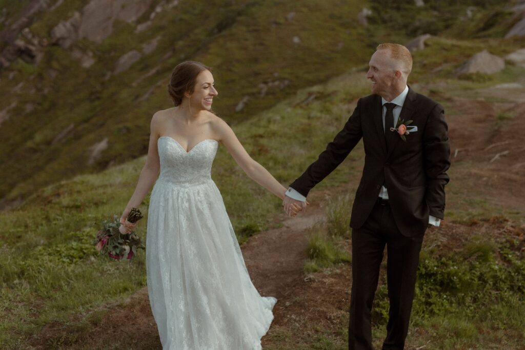 bride and groom laugh and hold hands during their Newfoundland elopement