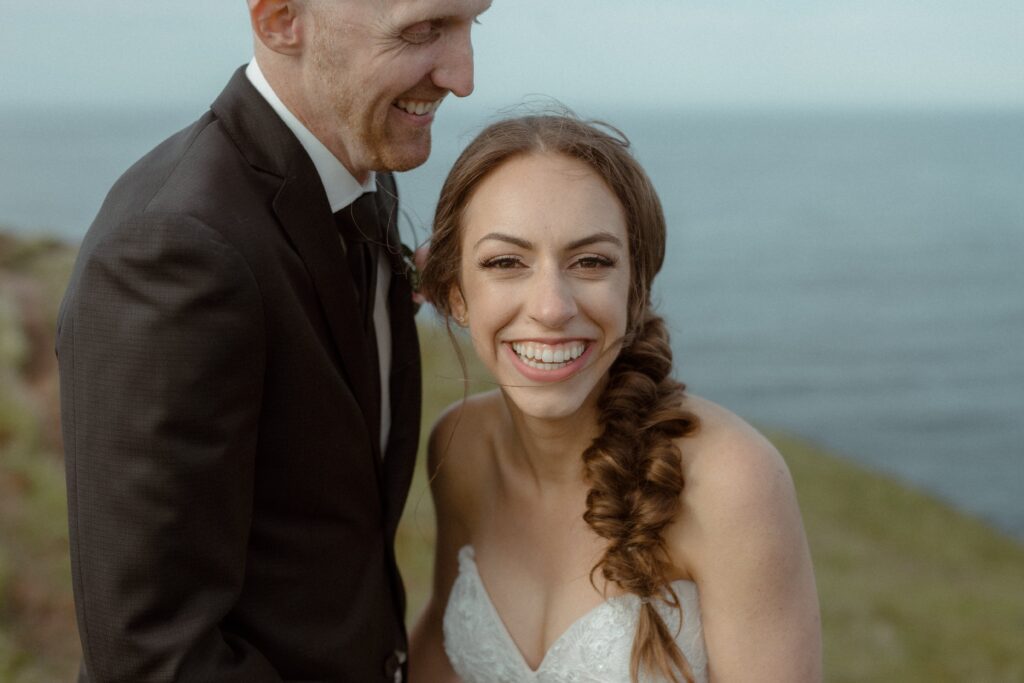 bride and groom laugh together during Newfoundland elopement