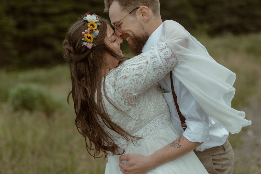 bride and groom look at each other and laugh during Newfoundland elopement