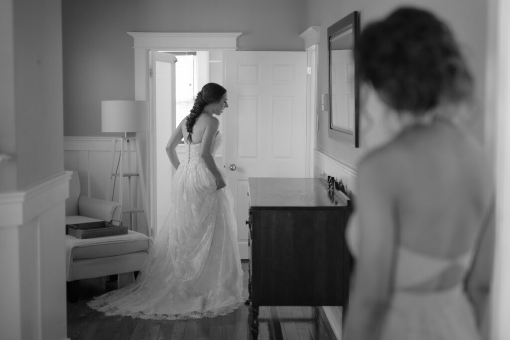 bride walks through the halls of historic Newfoundland home