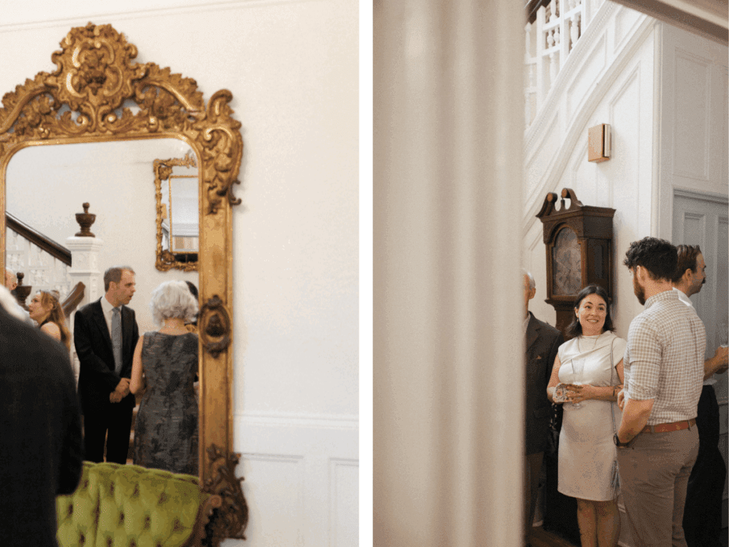 candid photo of bride and groom mingling with guests in a victorian home