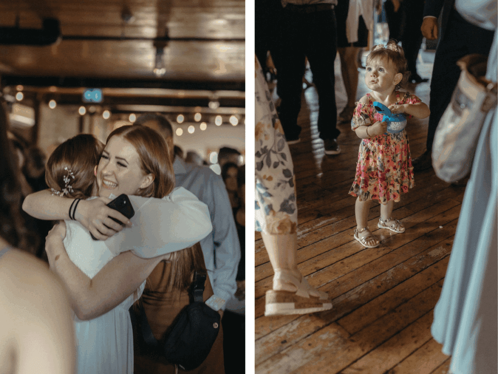 bride hugs her friend after the ceremony and a small girl holds a toy whale