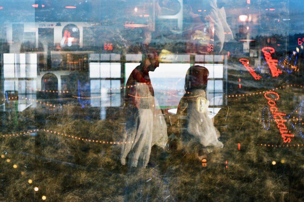 double exposure of couple at dive bar