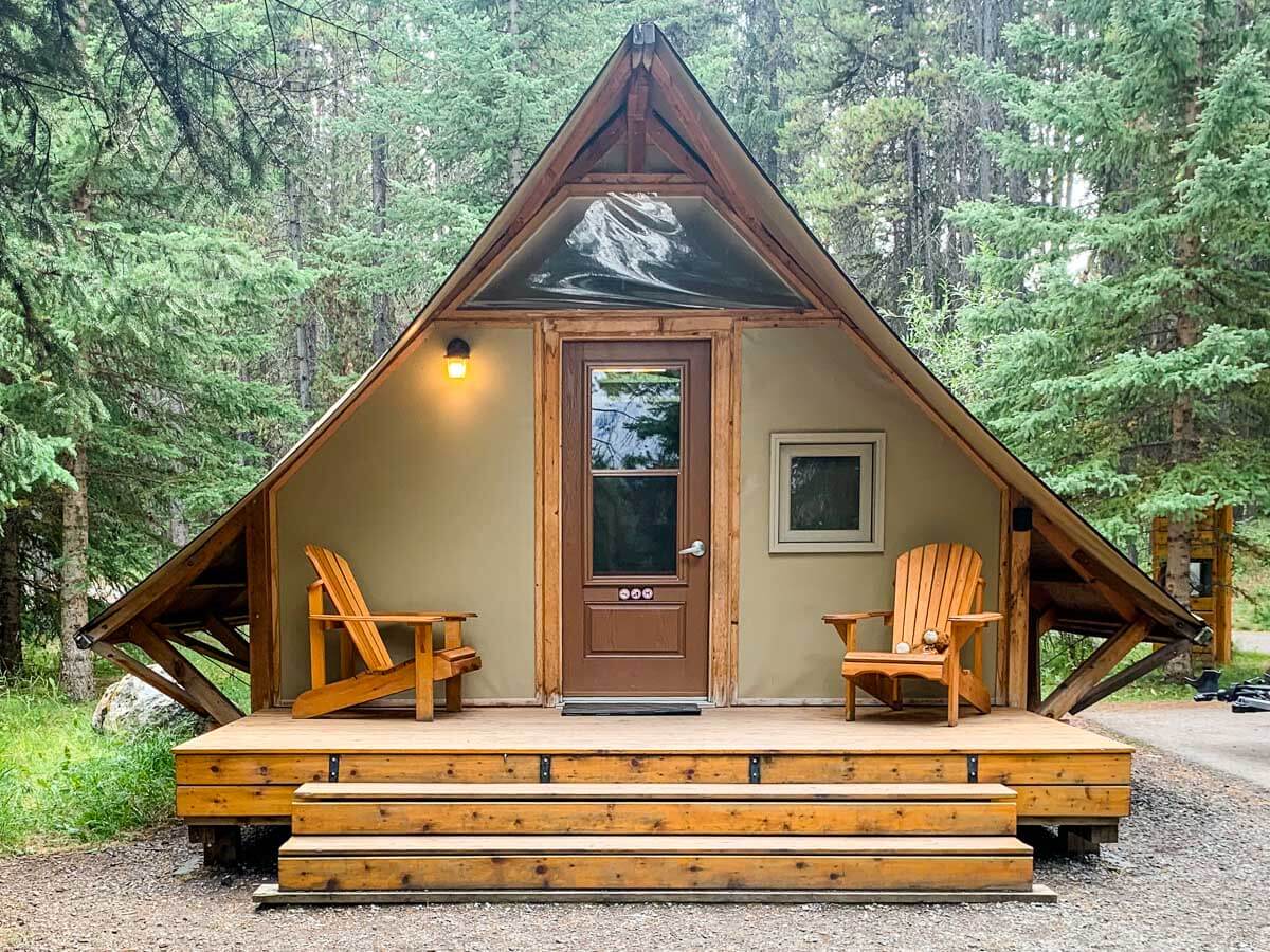 Parks Canada oTENTik cabin with forest in the background in Banff