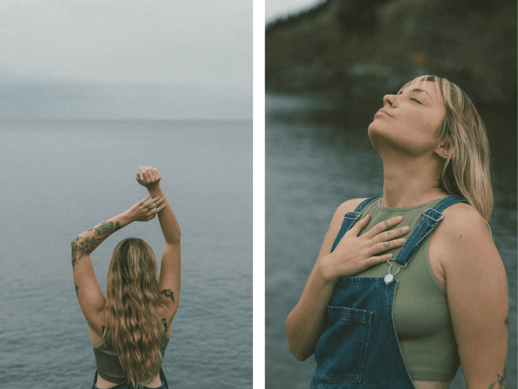 blonde woman with tattoos does a yoga pose on a rocky shore at sunset during Self Love Session