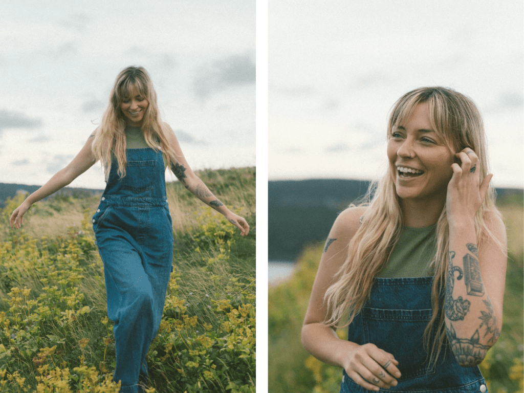 blonde woman with tattoos laughs in a field of yellow wildflowers during Self Love Session