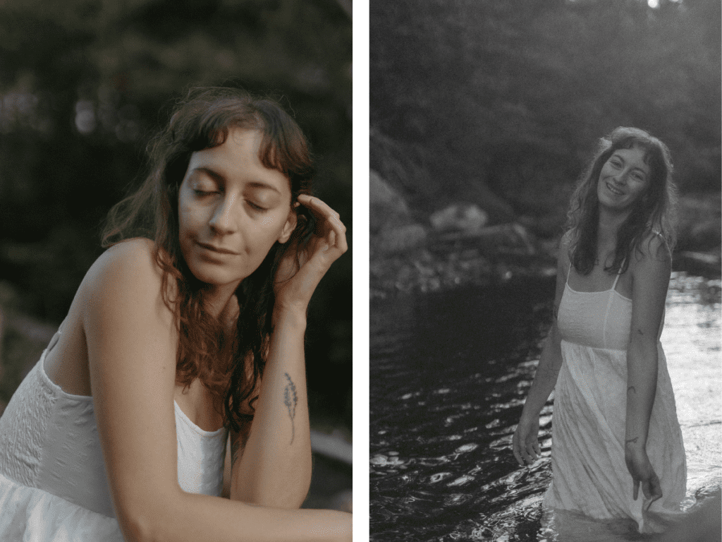 a woman in a long white dress laughs as she wades through a river
