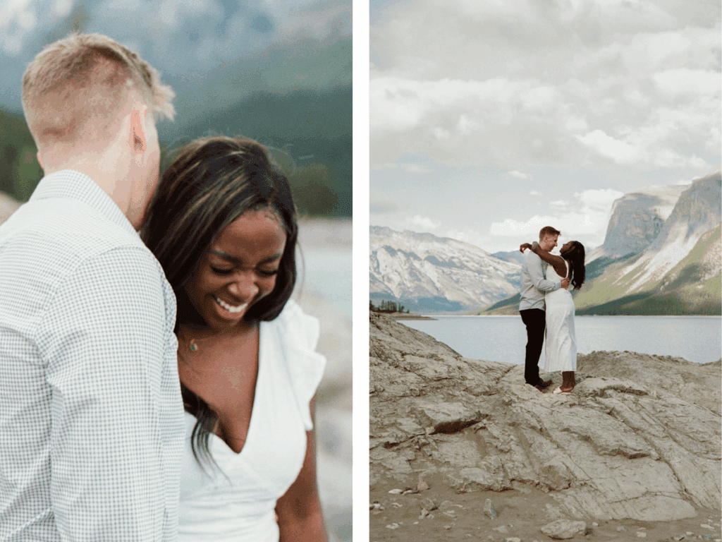 bride and groom hold each other and laugh by the lake in Banff National Park