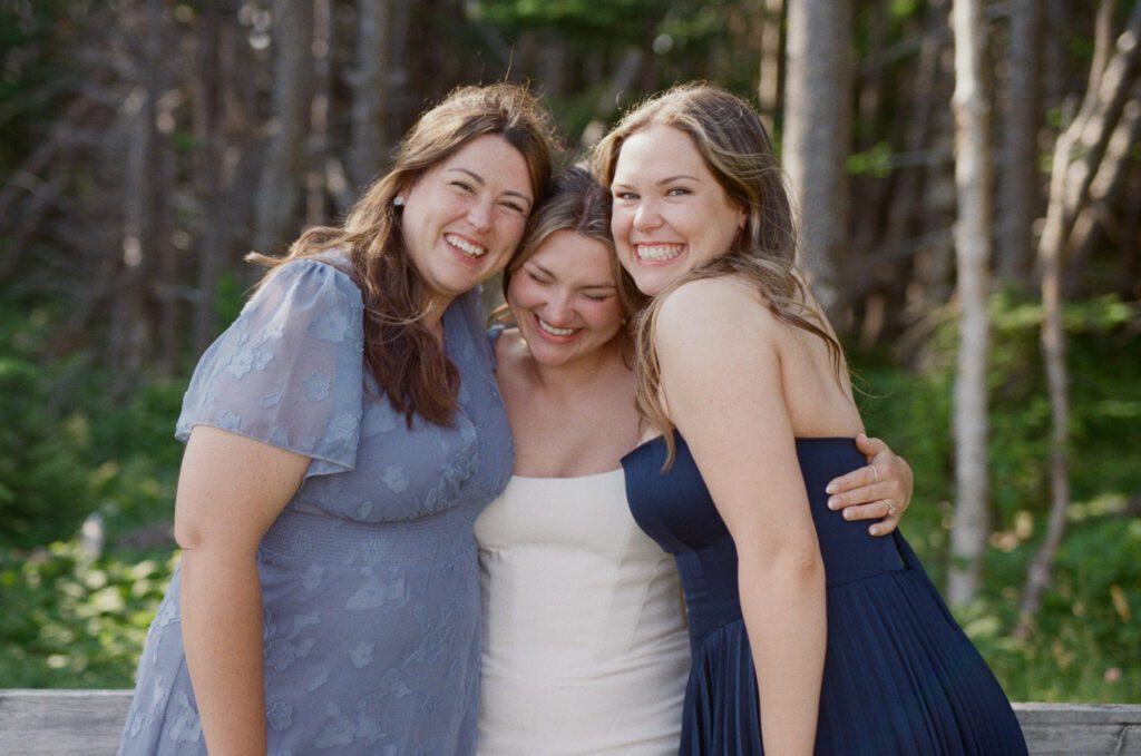 bride hugs her friend at Gros Morne wedding