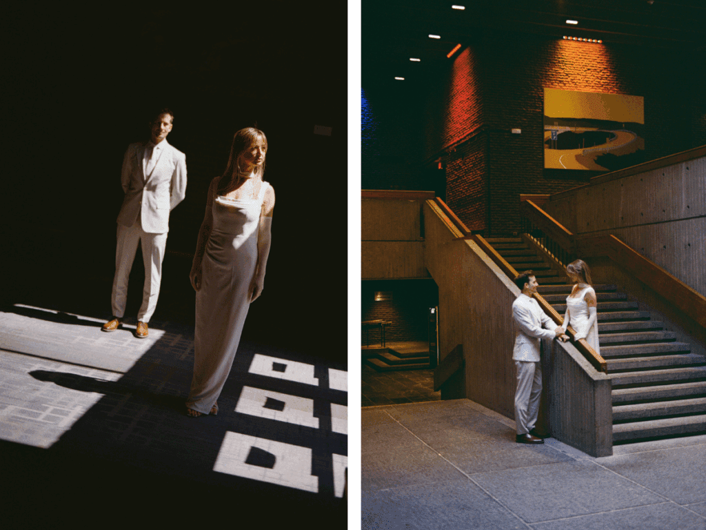 35 mm film photo of bride and groom posing on a staircase in an art gallery