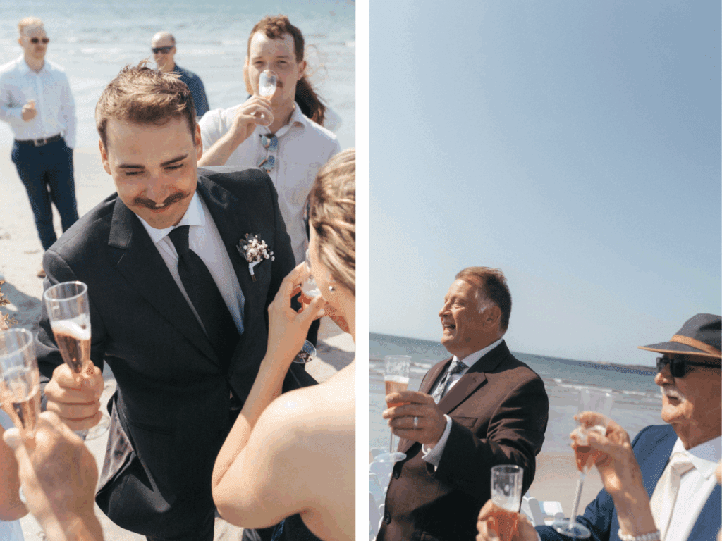 wedding guests raise their glasses of champagne on the beach