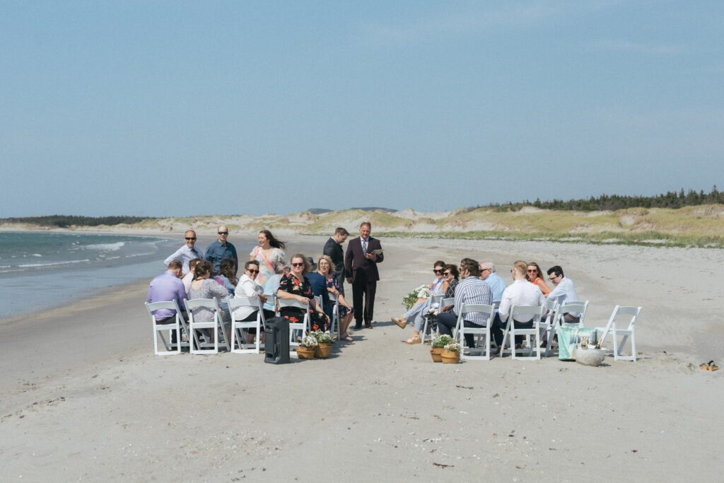 a wedding ceremony on a sandy beach 