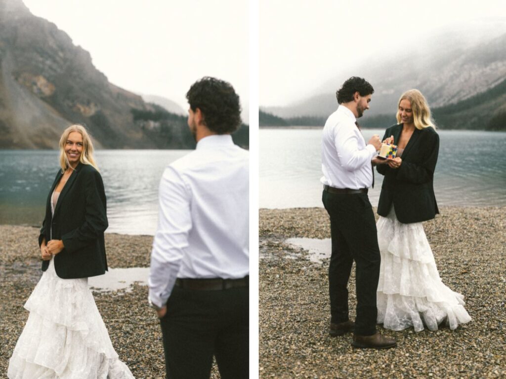 bride wears groom's suit jacket as they both take a bike of a mini cake
