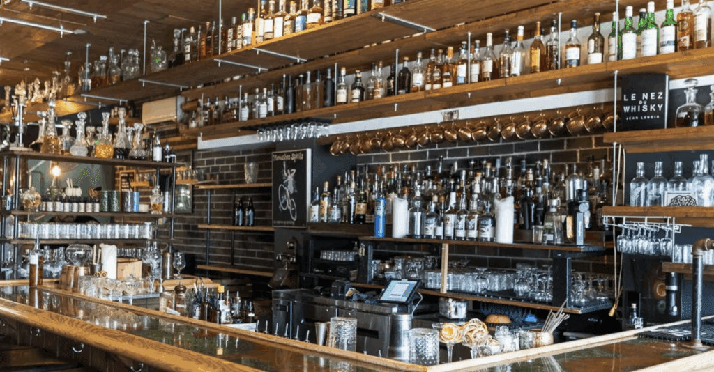 a wall of glass bottles at Monashee Spirits Craft Distillery in Revelstoke, BC