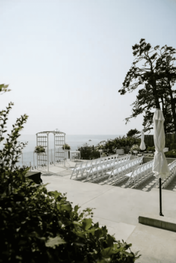 a balcony overlooking the sea is set up for a wedding in Sooke, Vancouver Island