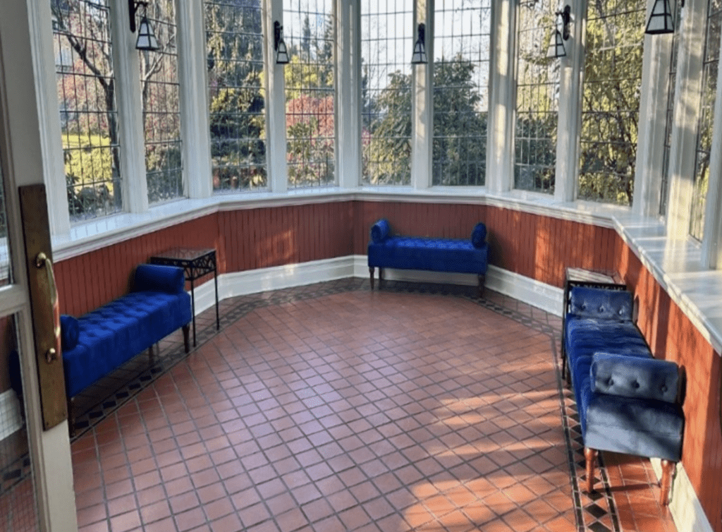 a room of high windows looking over the gardens at Vancouver Wedding Venue Cecil Green Park House